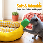 Cat exploring the banana-shaped pet bed indoors