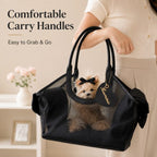 Black mesh pet carrier tote carried on a forearm with the dog looking out.