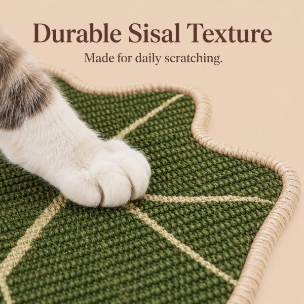 Botanical sisal cat scratcher mat closeup of woven green sisal beneath a cat's paw.