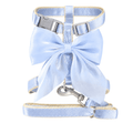 Blue bow cat harness and leash set on a clean background