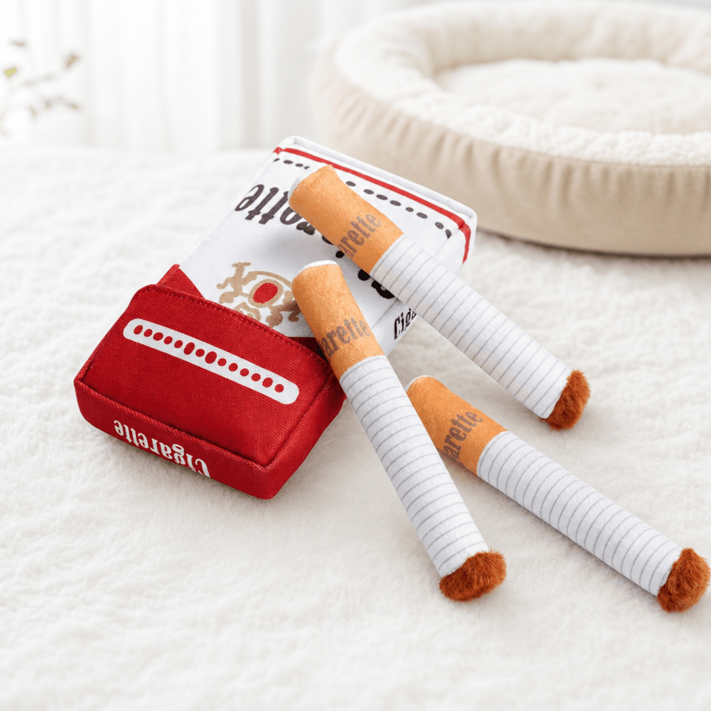 Complete cigarette-shaped plush dog toy set arranged indoors