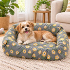 Floral replacement dog bed cover on a bolster bed with a small dog resting beside a sofa.