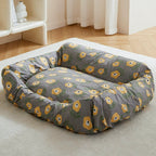 Floral replacement dog bed cover fitted on a rectangular bed in a sunlit room.