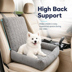 Gray corduroy dog car seat bed with arrows highlighting the tall backrest behind a white dog.