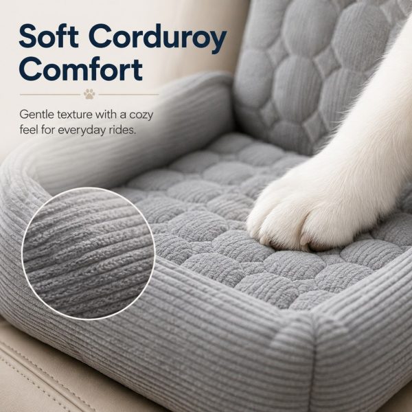 Gray corduroy dog car seat bed closeup showing a dog's paw on the corduroy cushion.