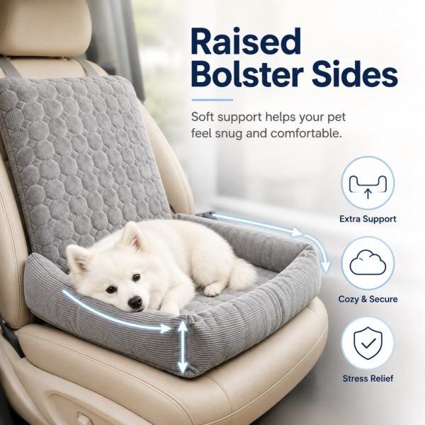 Gray corduroy dog car seat bed with a resting dog and arrows marking the raised bolsters.