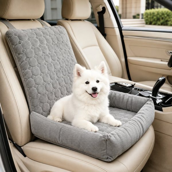 Gray corduroy dog car seat bed with a white dog sitting on a beige passenger seat.