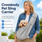 Gray crossbody pet sling carrier modeled outdoors with the shoulder strap across the body.