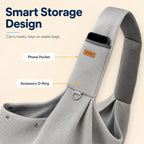 Gray crossbody pet sling carrier showing the phone pocket and accessory ring on the strap.
