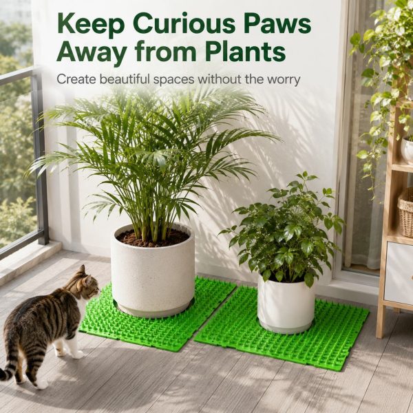 Green cat deterrent mat placed around plant pots beside a curious cat.