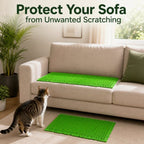 Green cat deterrent mat placed on a sofa seat and on the floor below.