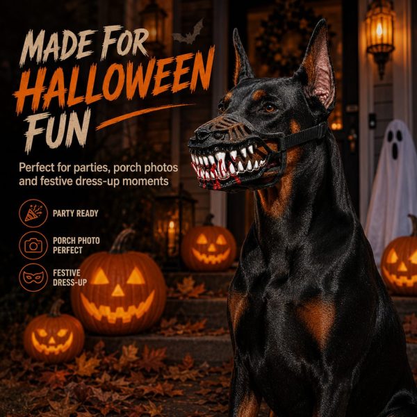 Halloween monster dog muzzle costume worn by a sitting dog beside carved pumpkins.
