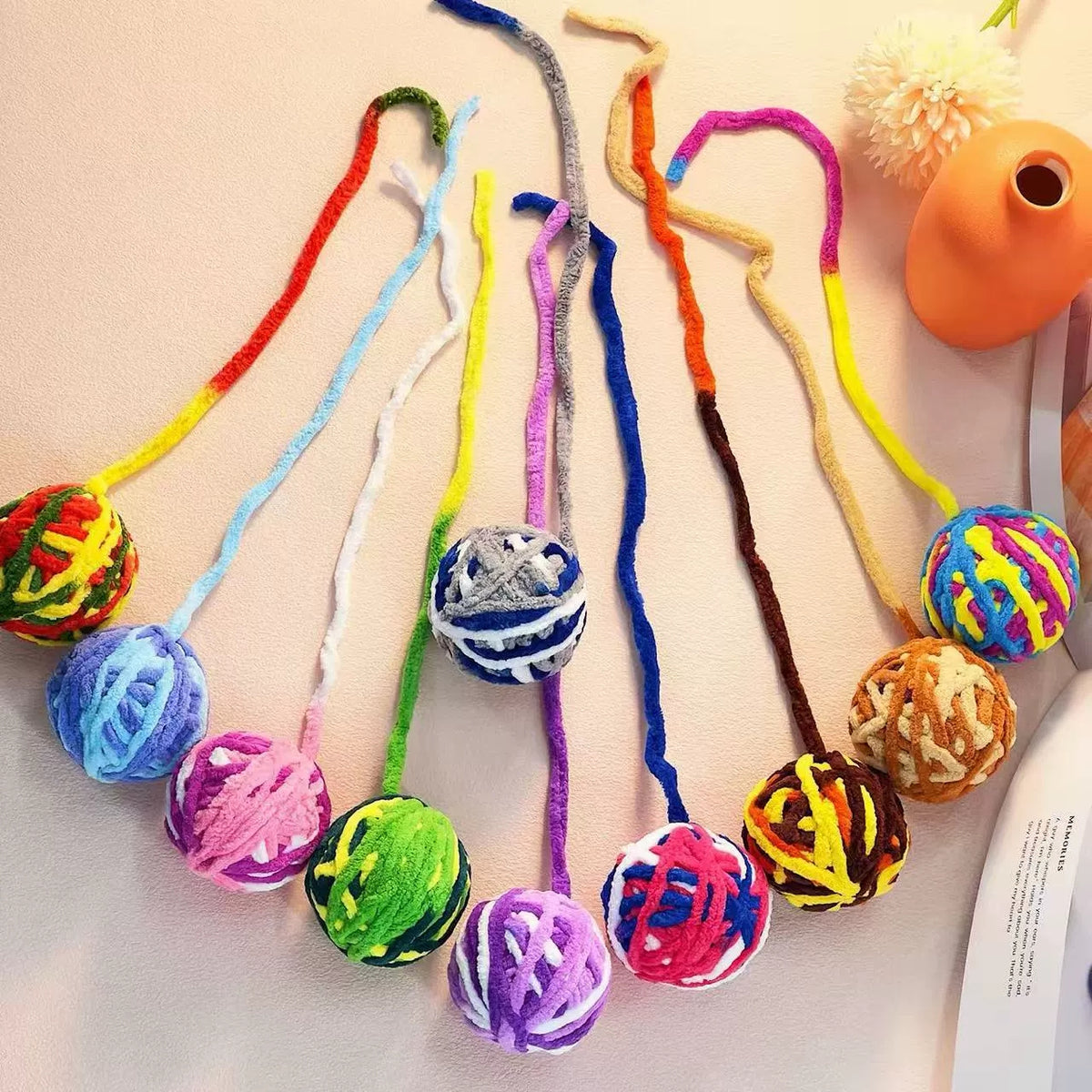 Full assortment of mixed-color cat ball toys laid out together