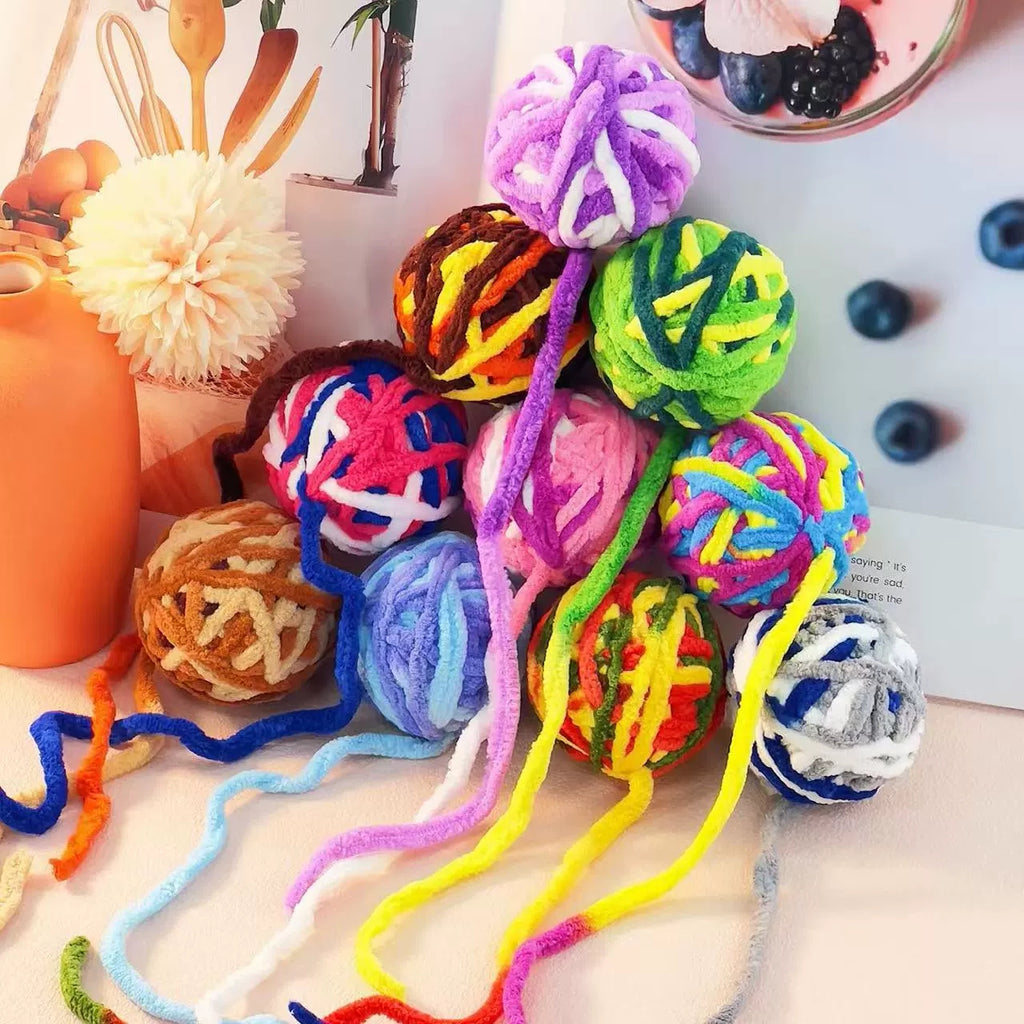 Close view of the texture on the mixed-color cat ball toys
