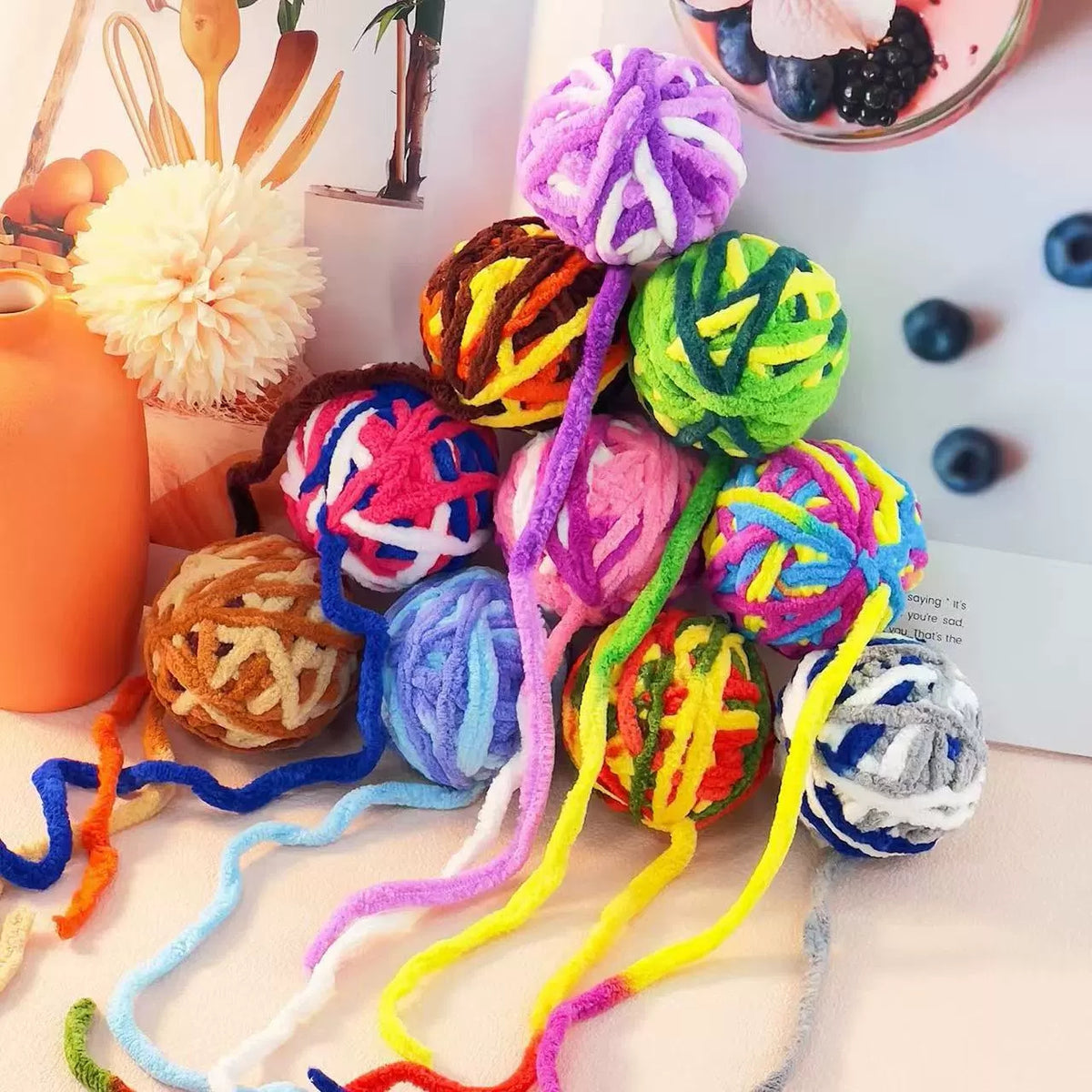 Close view of the texture on the mixed-color cat ball toys