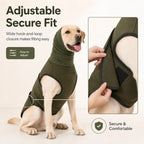 Olive green dog calming shirt showing hands adjusting the side closure on a dog.