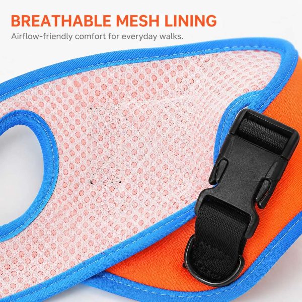 Orange and blue wrist dog leash closeup of the mesh lining and quick release buckle.