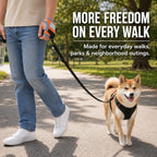 Orange and blue wrist dog leash used on a park walk with a small dog.