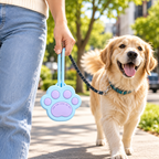 Paw-shaped silicone pet treat pouch carried during a dog walk