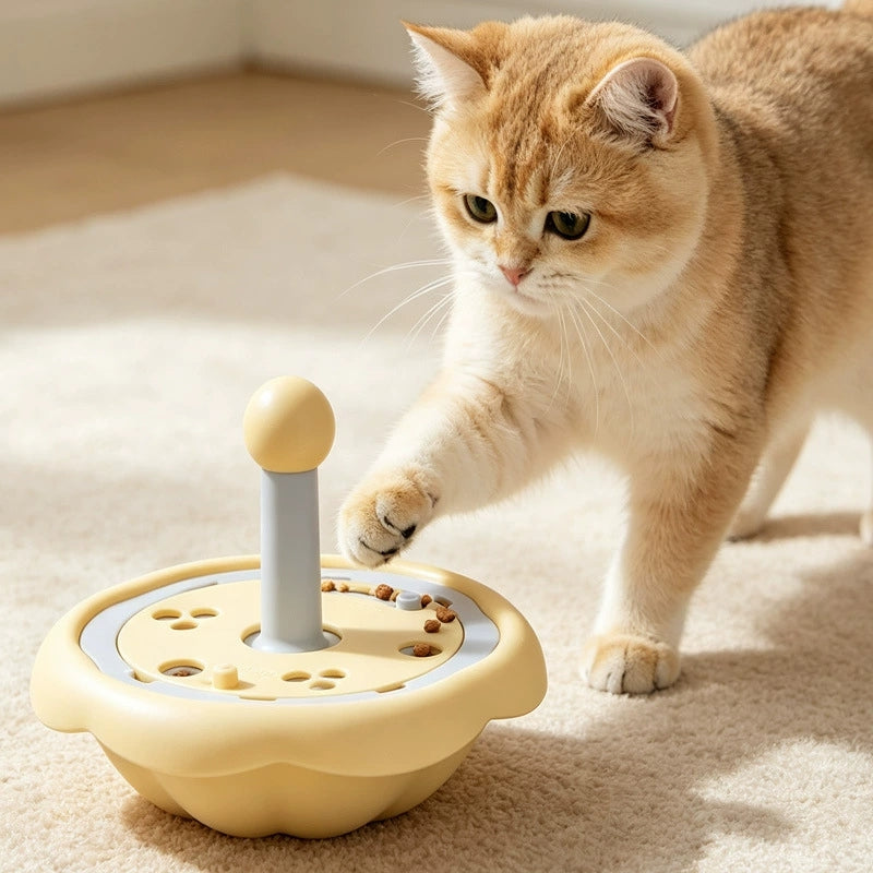 Rotating pet puzzle feeder with a cat using the treat puzzle