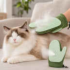 Spray pet grooming glove in green releasing mist while grooming a cat on a sofa.